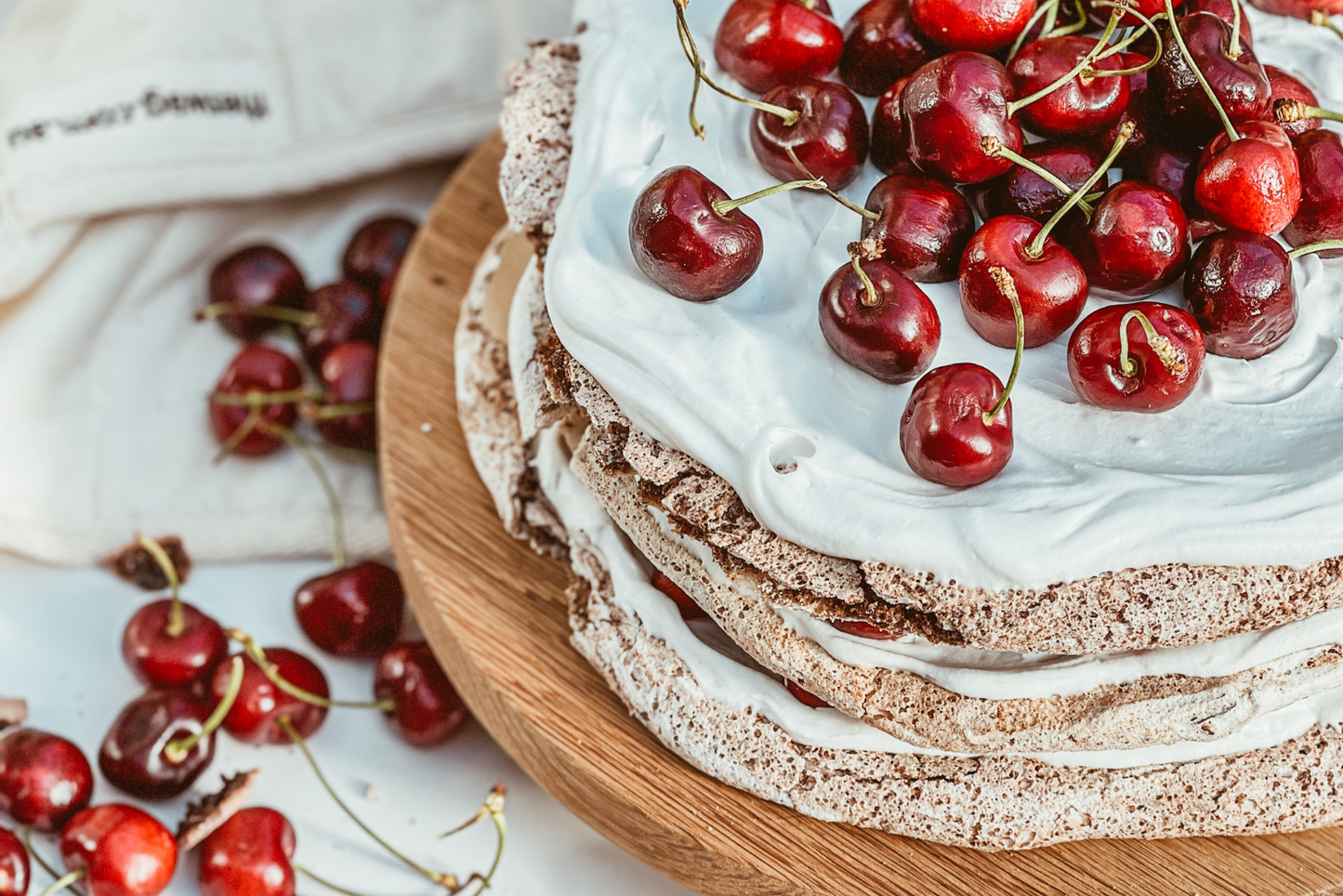 Vegan Chocolate Cherry Hazelnut Meringue Cake with Whipped Coconut Cream