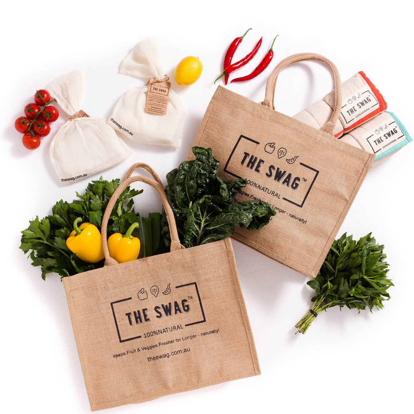 The Swag Plastic-Free Shopping Bundle showing all six items laid out with fresh produce in and around them - The Swag AU