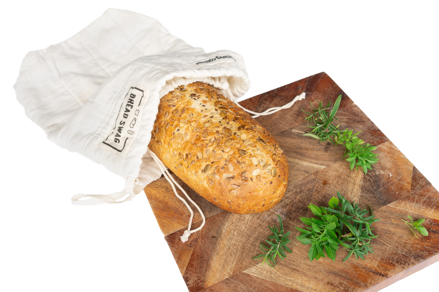 The Swag reusable Bread bag on a bread board with sourdough bread inside the bag - The Swag AU