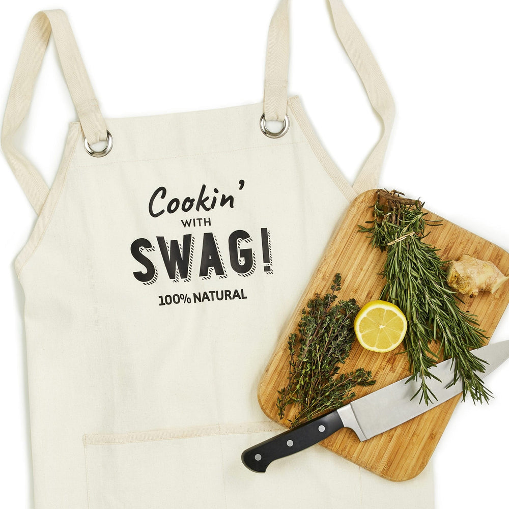 A gorgeous, beautifully hand made apron made from unbleached unseeded cotton and featuring the slogan 